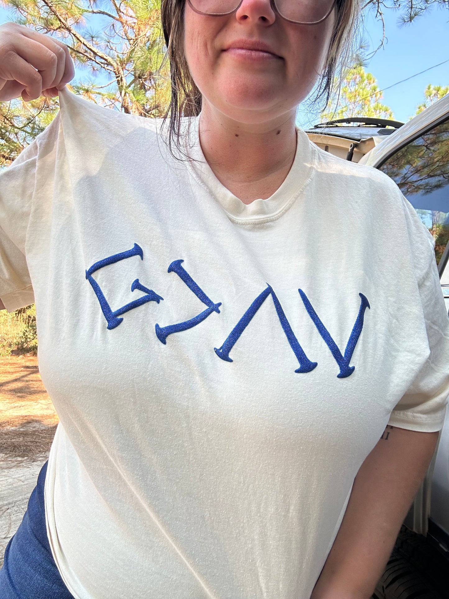 God is Greater Symbols Glitter Puff Print Top