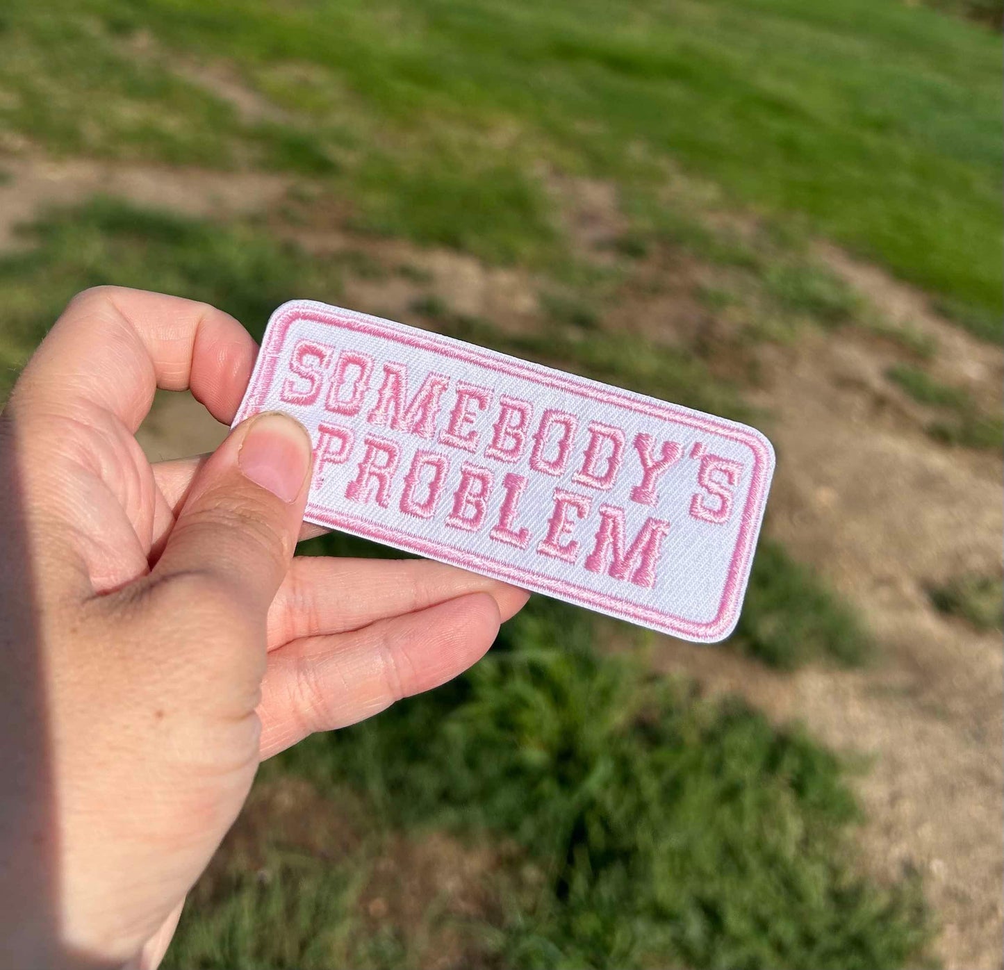 Pink Somebodys Problem Hat Patch