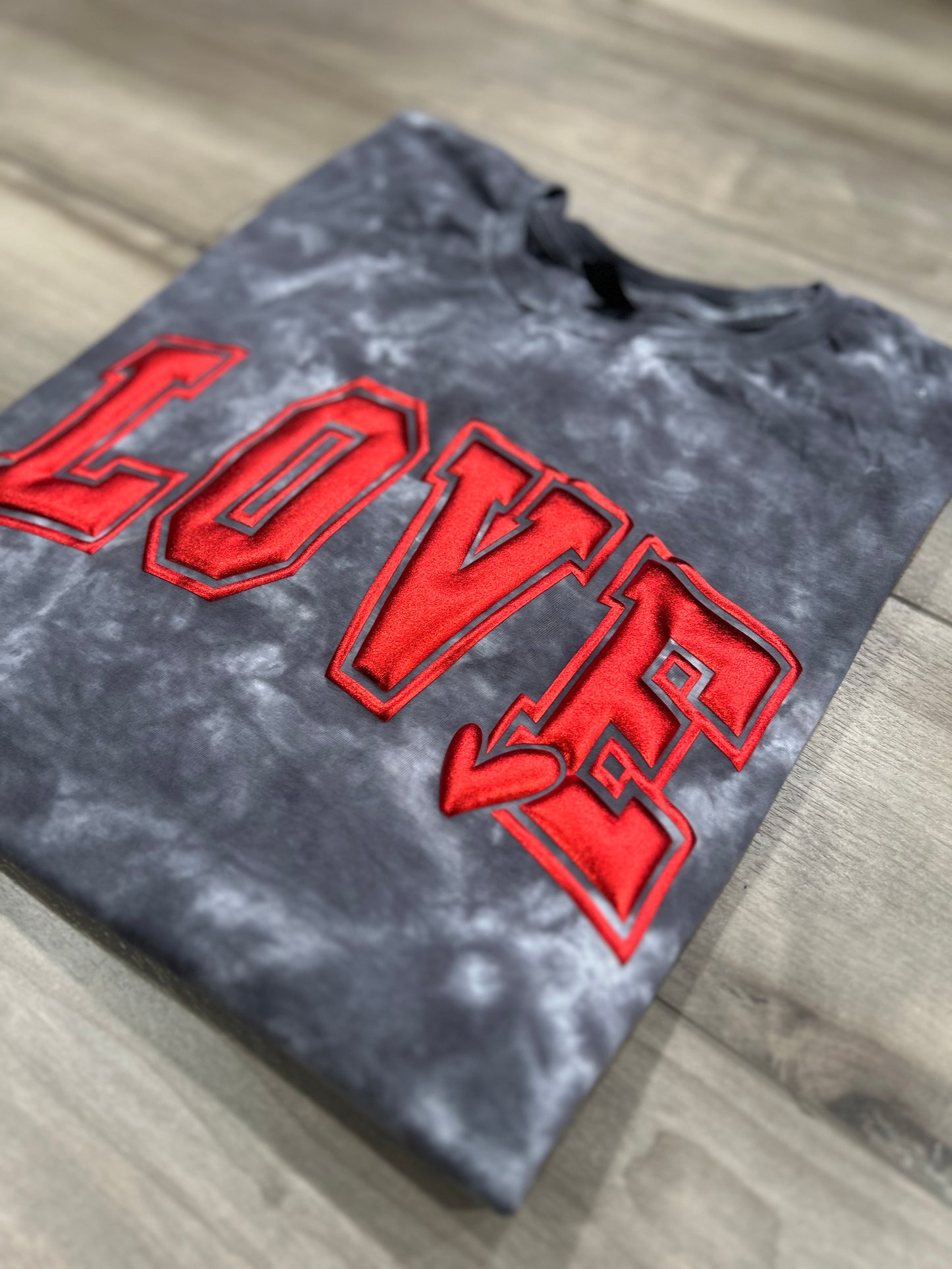 Love Metallic Puff Print Tie Dye top in Black