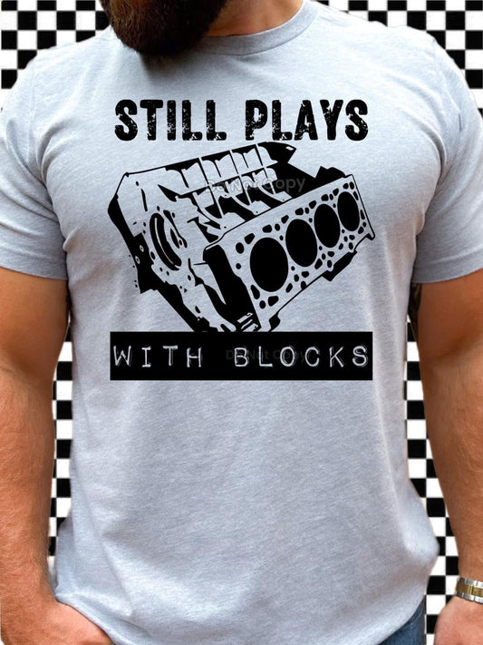Still plays with blocks Top